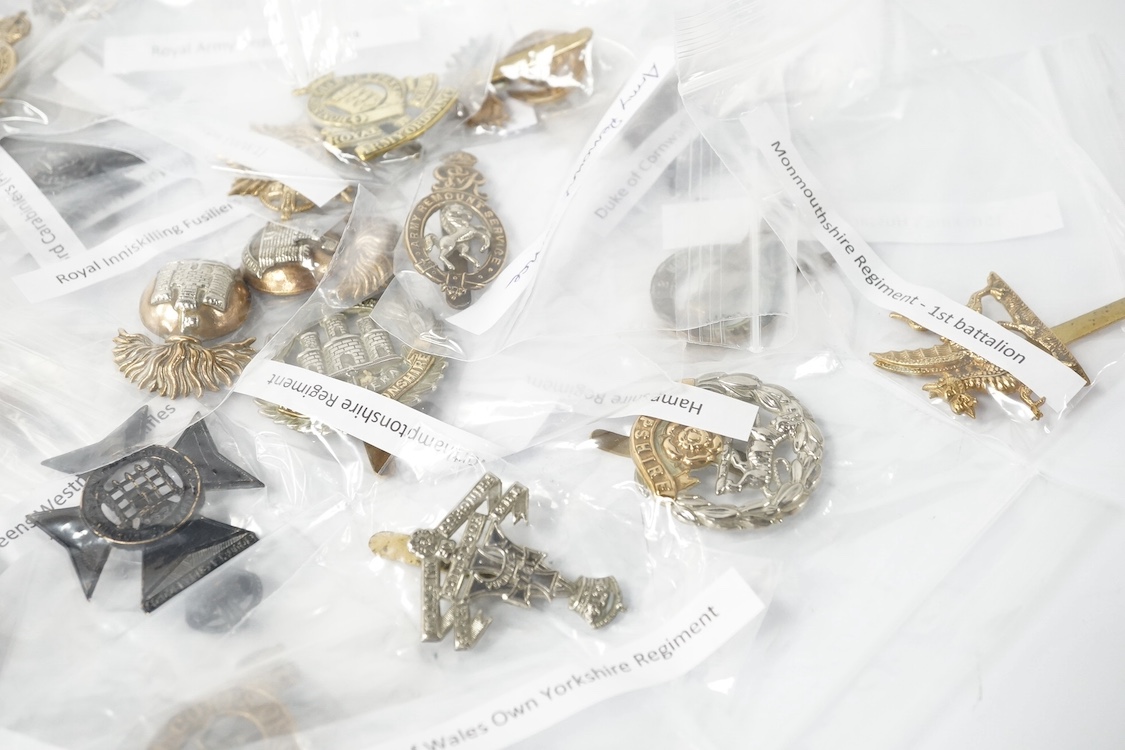 Forty military cap badges including; the 20th Hussars regiment, Royal Pioneer Corps, Army Music Corps, Women’s Army Auxiliary Corps, Army Veterinary Corps, Queen Mary’s Regiment Surrey Yeomanry, Royal East Kent regiment,